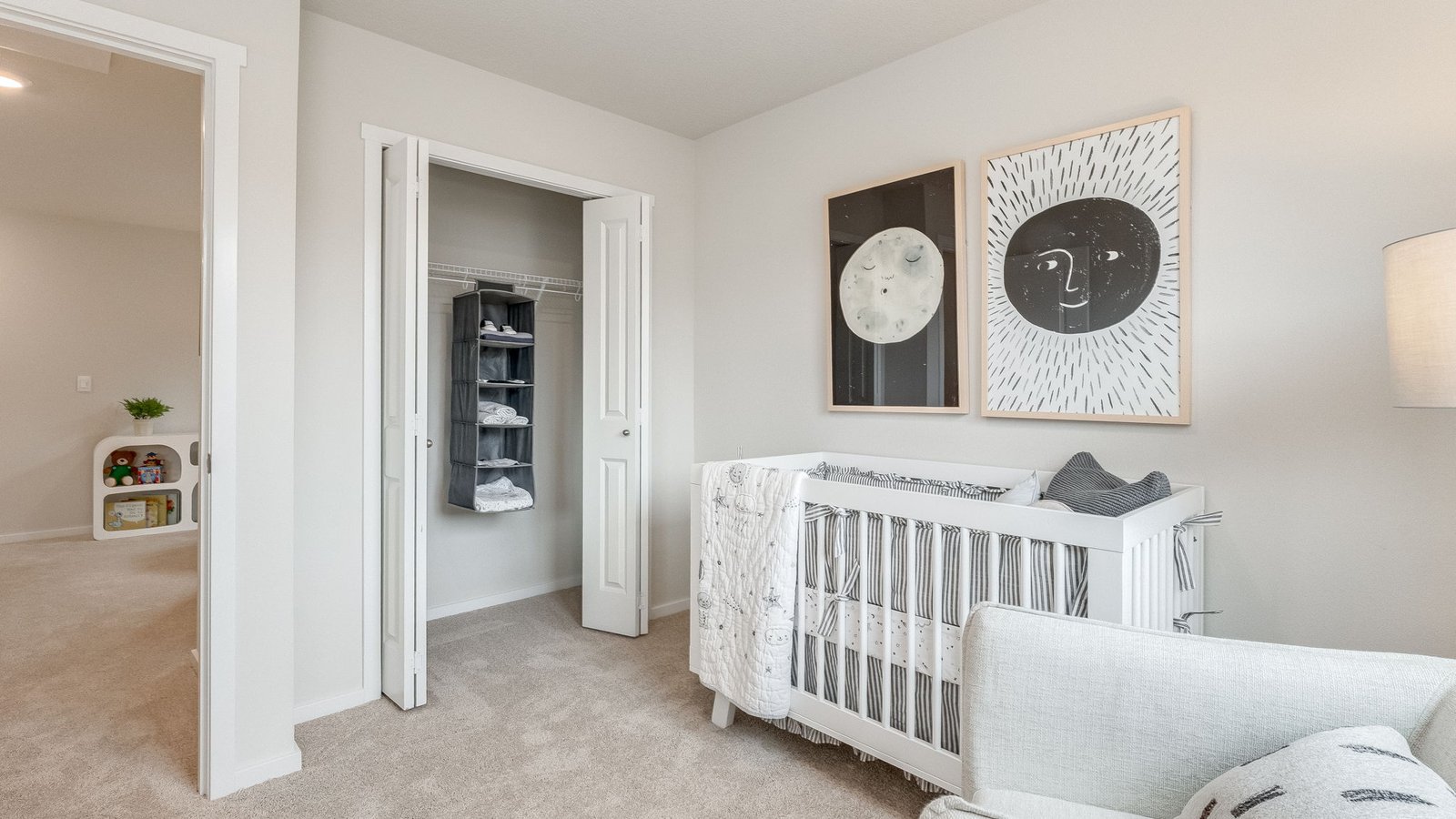Bedroom with wall-to-wall carpet and a closet