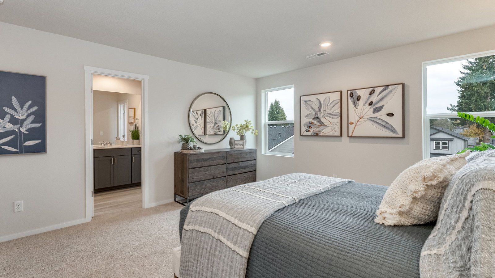Primary bedroom with wall-to-wall carpet, a walk-in closet and an attached bathroom