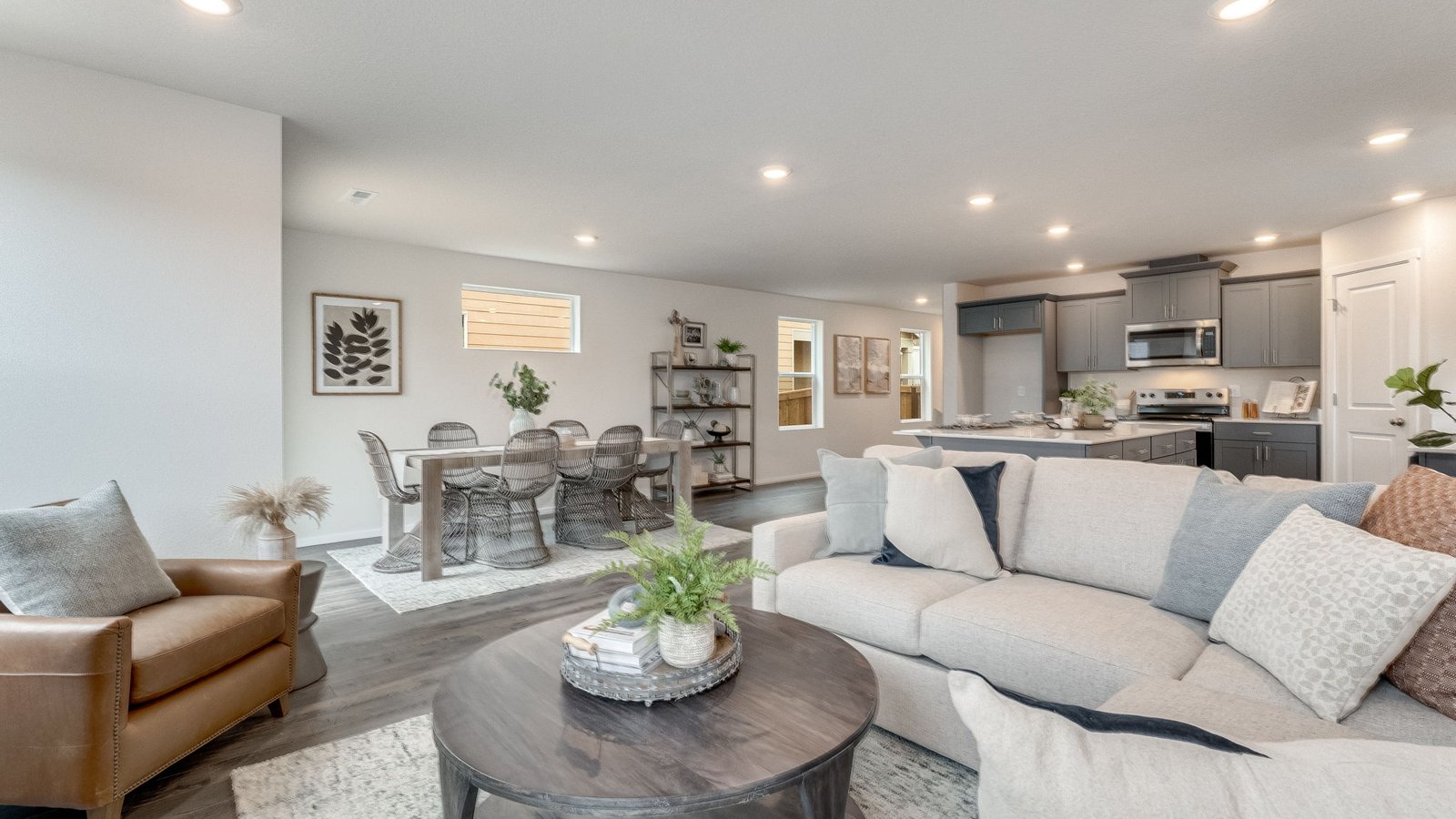 Great room with laminate flooring and an electric fireplace