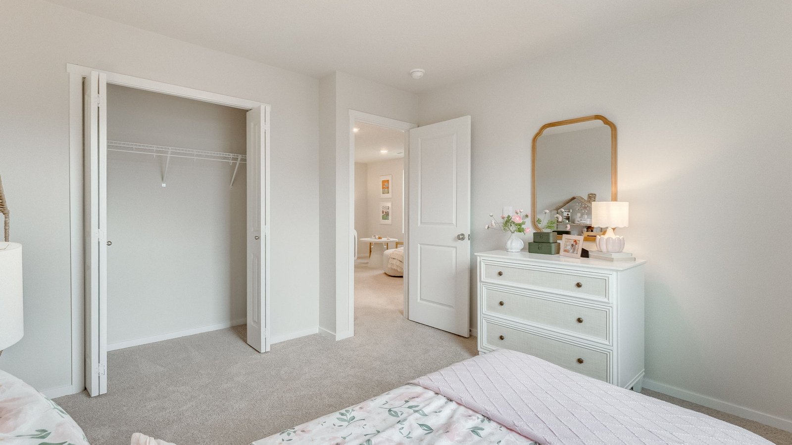 Bedroom with wall-to-wall carpet and a closet