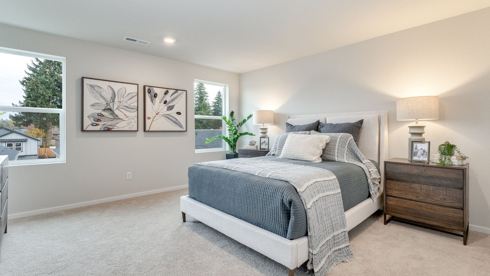 Primary bedroom with wall-to-wall carpet, a walk-in closet and an attached bathroom
