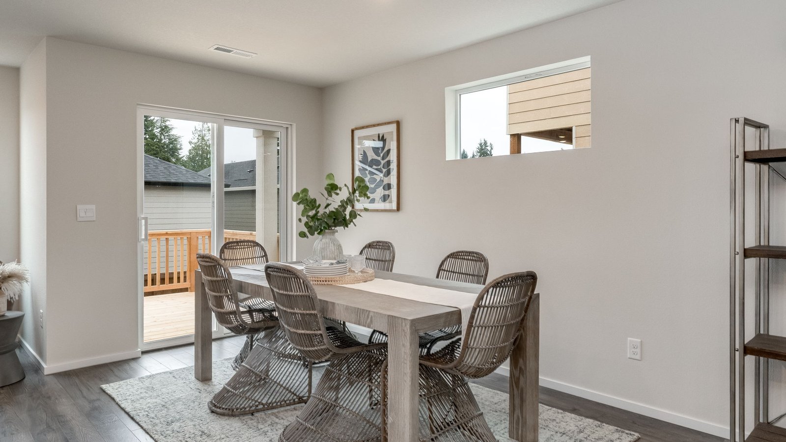 Dining area with a sliding glass door to a fenced backyard