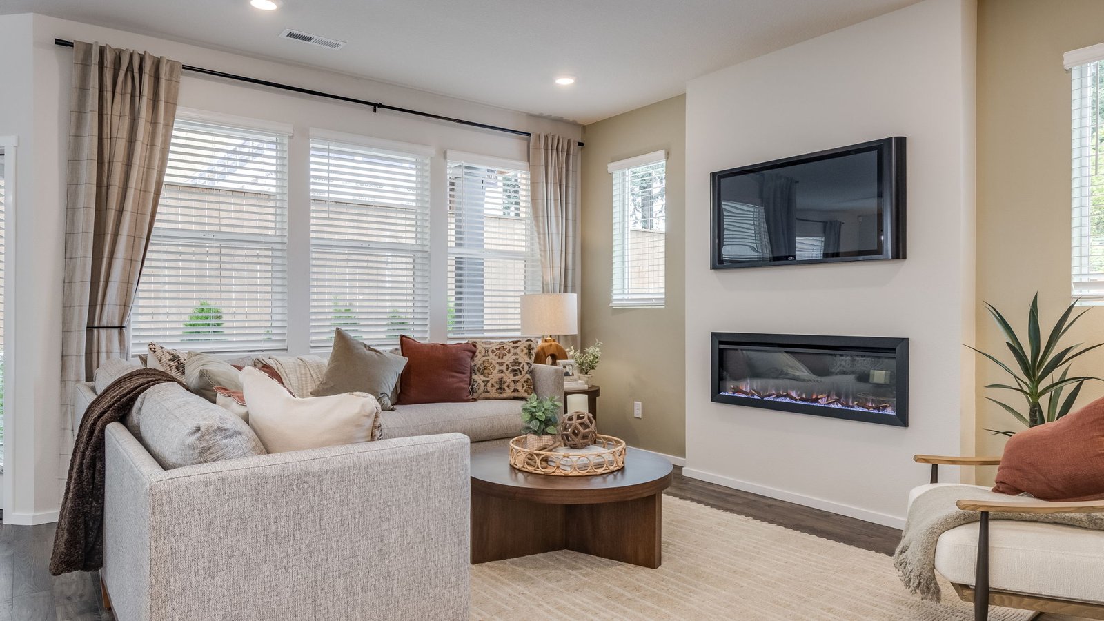 Great room with laminate flooring and an electric fireplace
