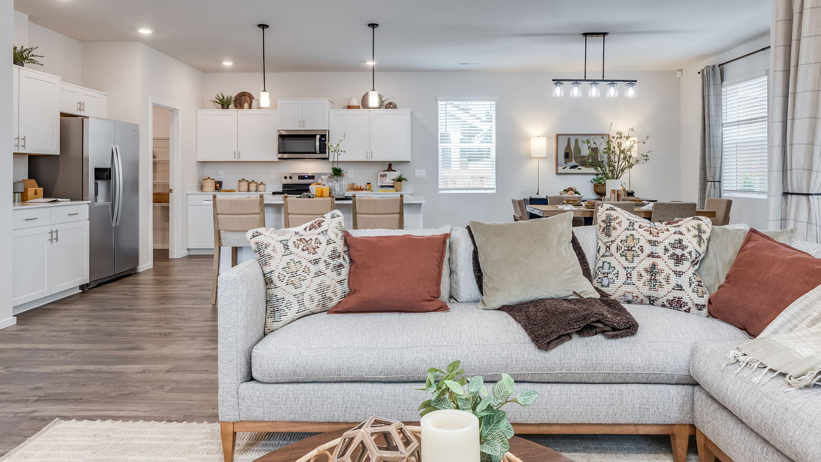 Great room with laminate flooring and an electric fireplace