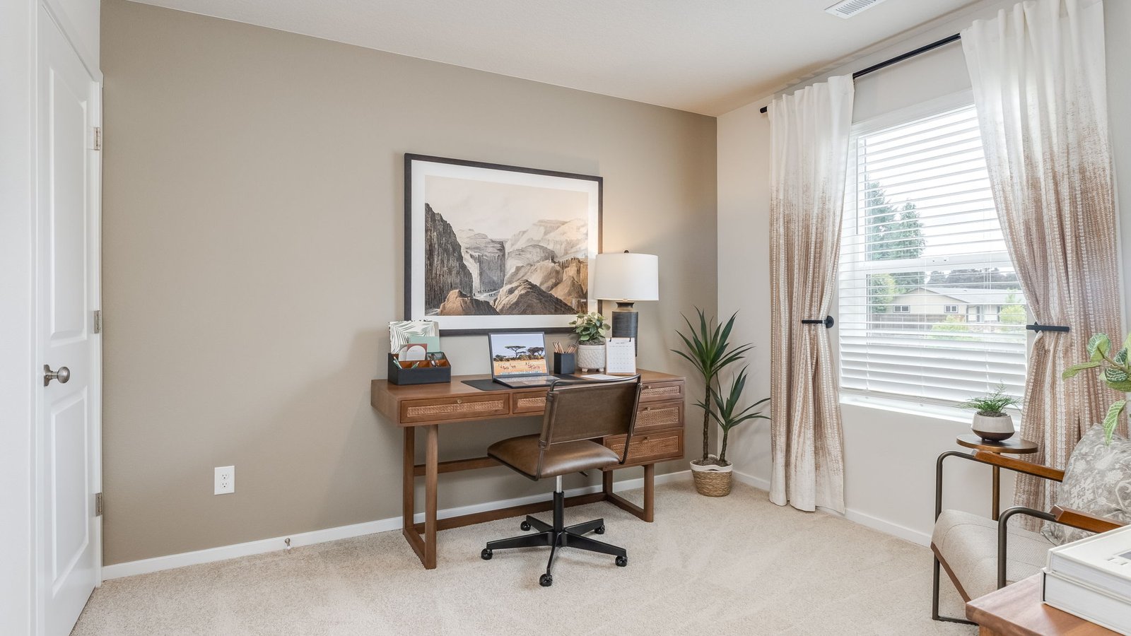 Bedroom with wall-to-wall carpet and a closet