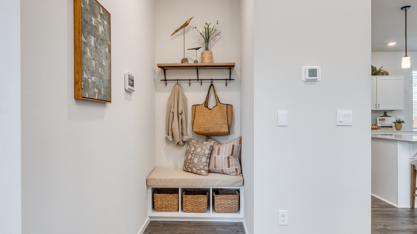 Entryway with a coat closet and laminate flooring