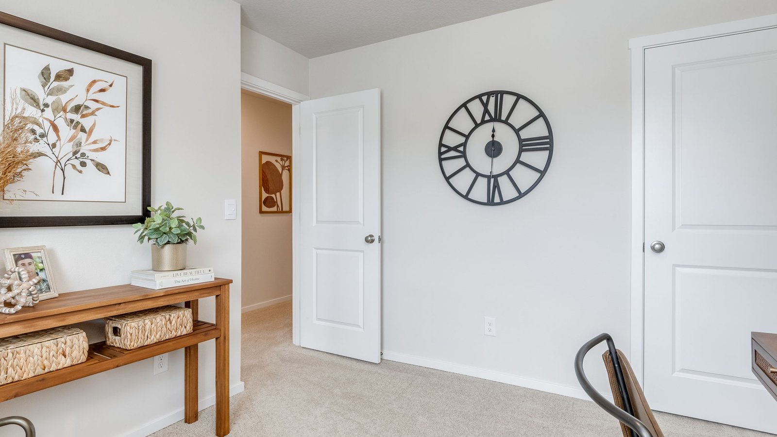Bedroom with wall-to-wall carpet and a closet
