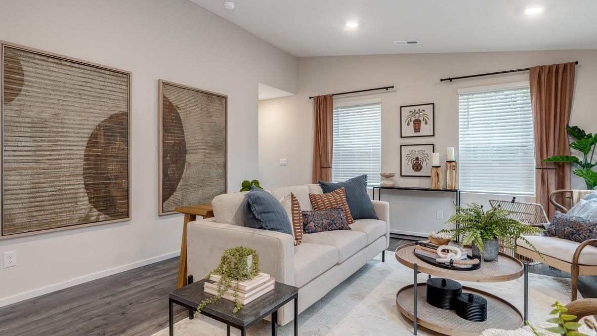 Great room with laminate flooring and an electric fireplace and vaulted ceilings