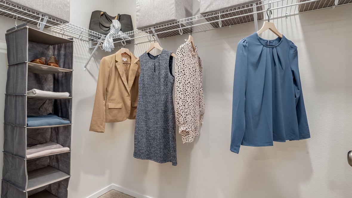 Primary bedroom walk-in closet with wire shelves