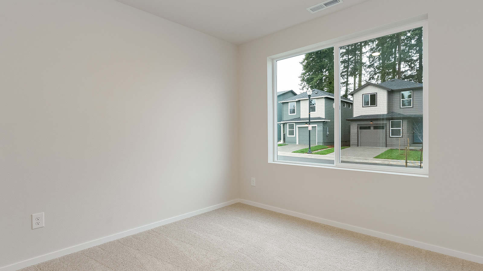 Bedroom with wall-to-wall carpet and a closet