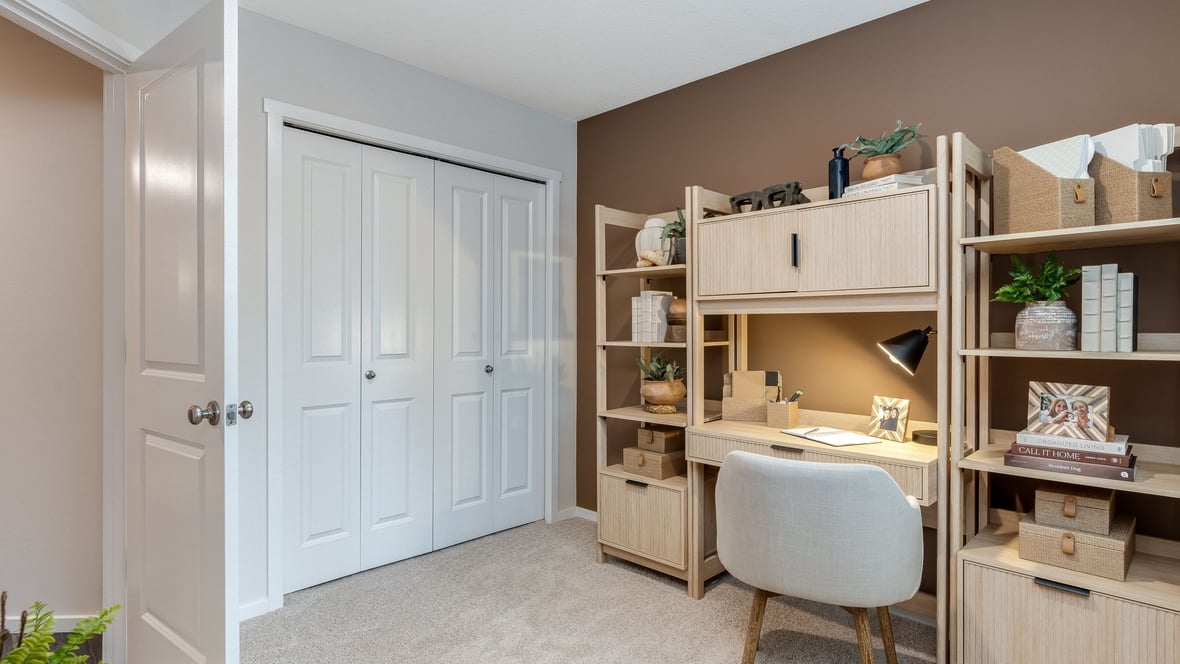 Bedroom with wall-to-wall carpet and a closet