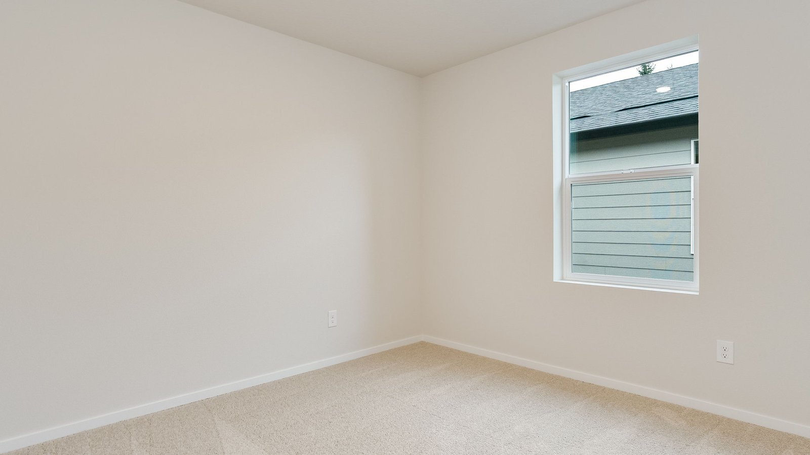 Bedroom with wall-to-wall carpet and a closet
