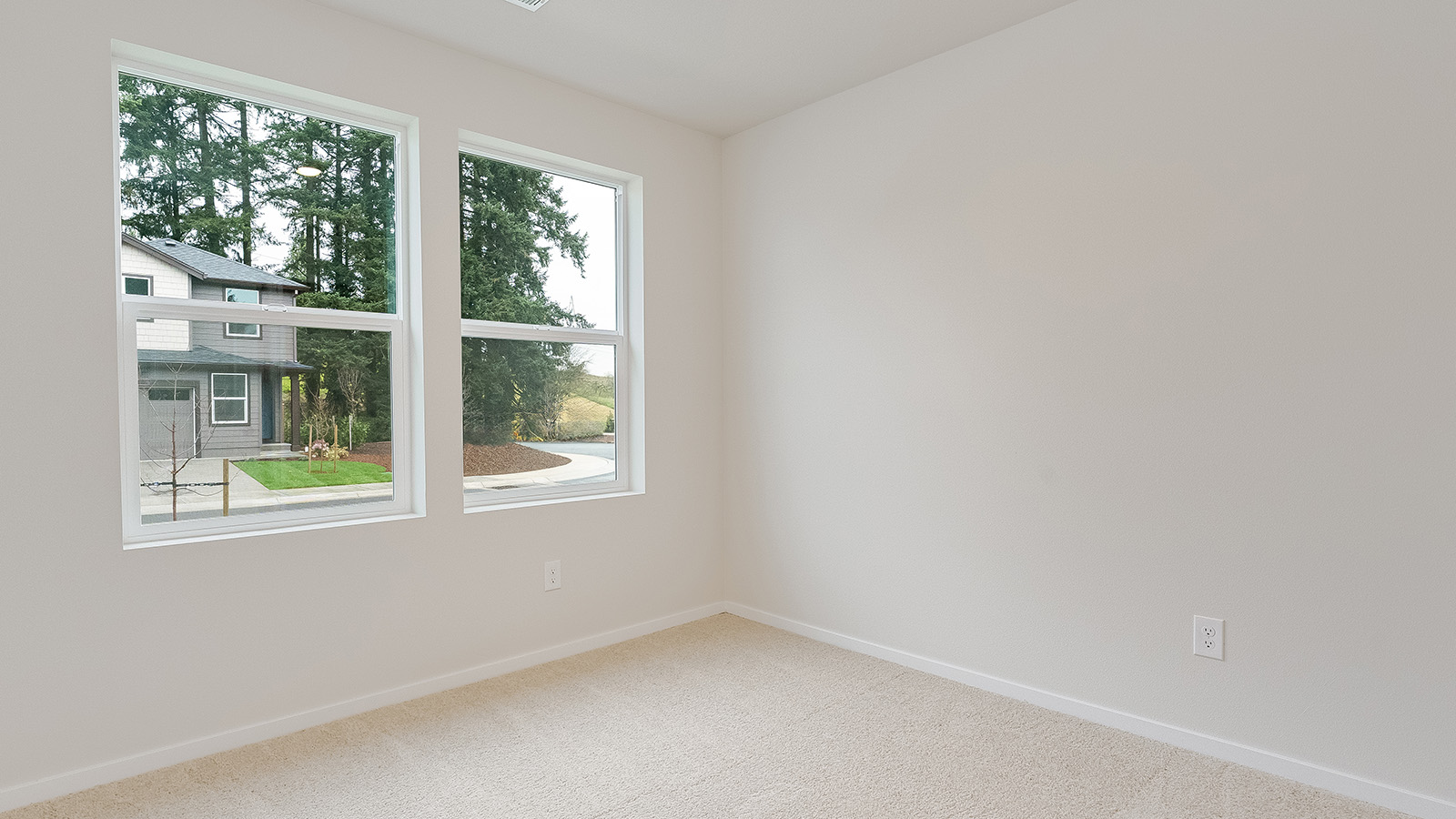 Bedroom with wall-to-wall carpet and a closet