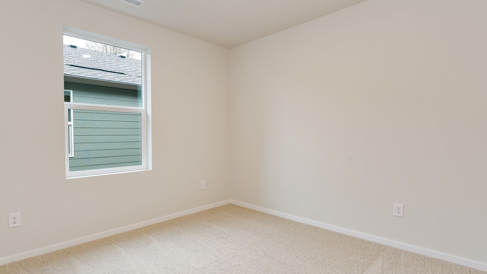 Bedroom with wall-to-wall carpet and a closet
