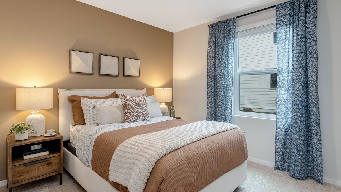 Bedroom with wall-to-wall carpet and a closet