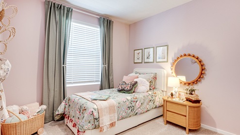 Child’s bedroom with wall-to-wall carpet and a closet