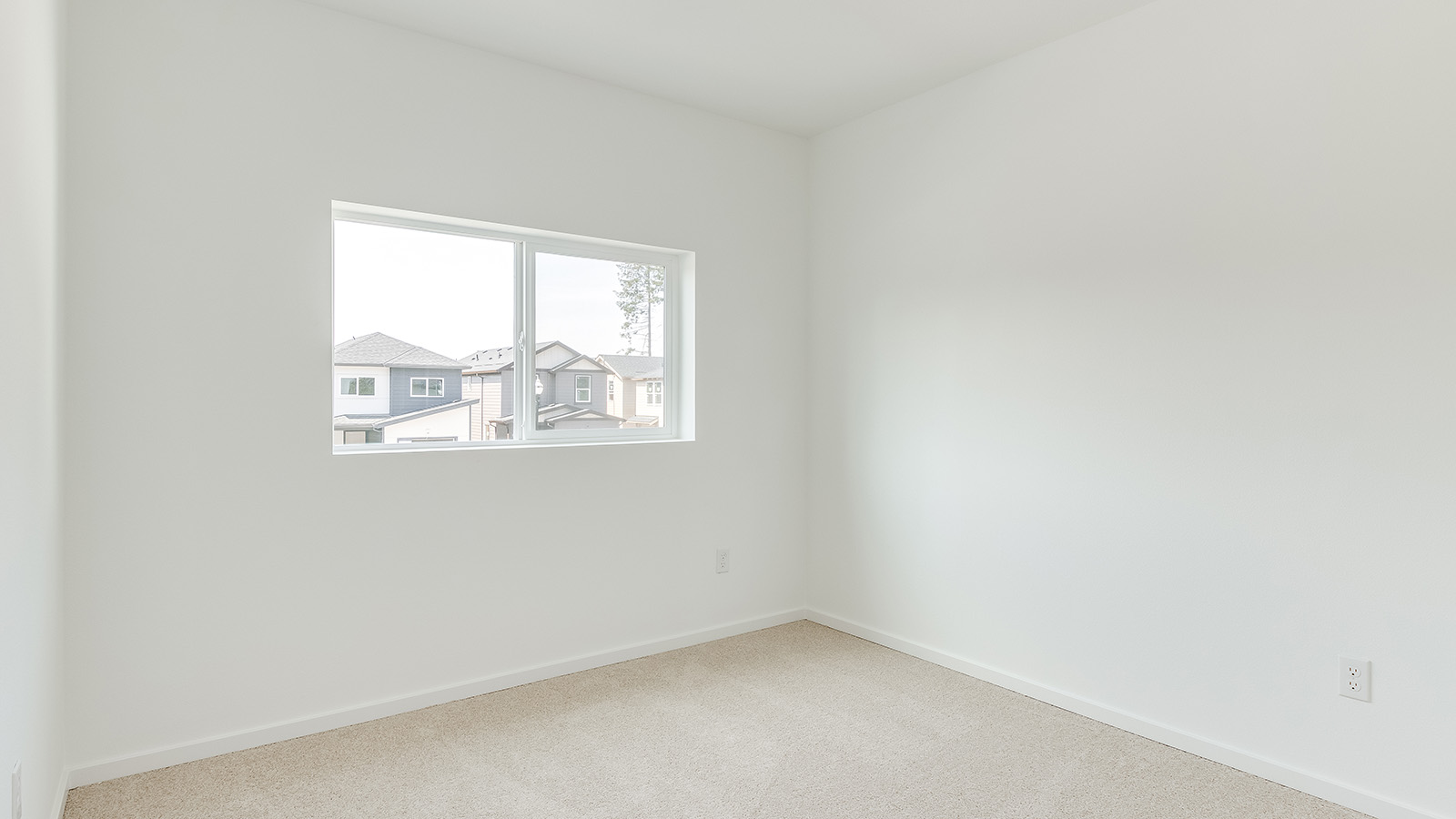 Bedroom with wall-to-wall carpet and a closet