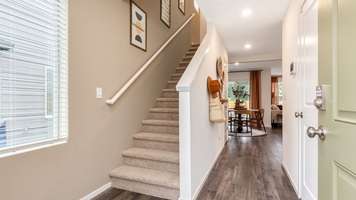 Entryway with a coat closet and laminate flooring