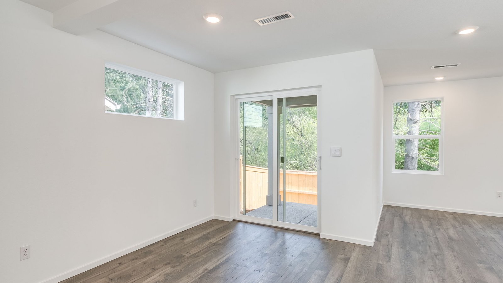 Dining area with a sliding glass door to a fenced backyard