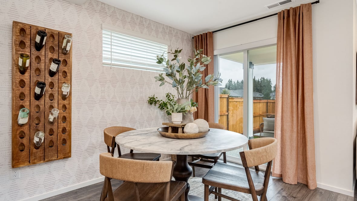 Dining area with a sliding glass door to a fenced backyard