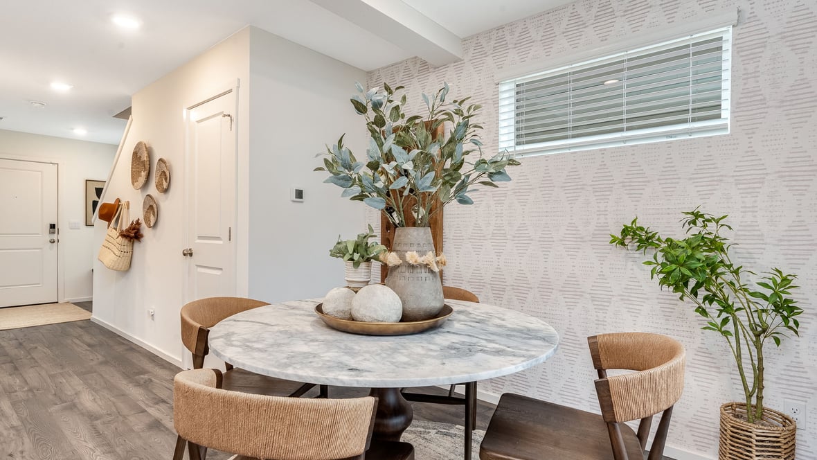 Dining area with a sliding glass door to a fenced backyard