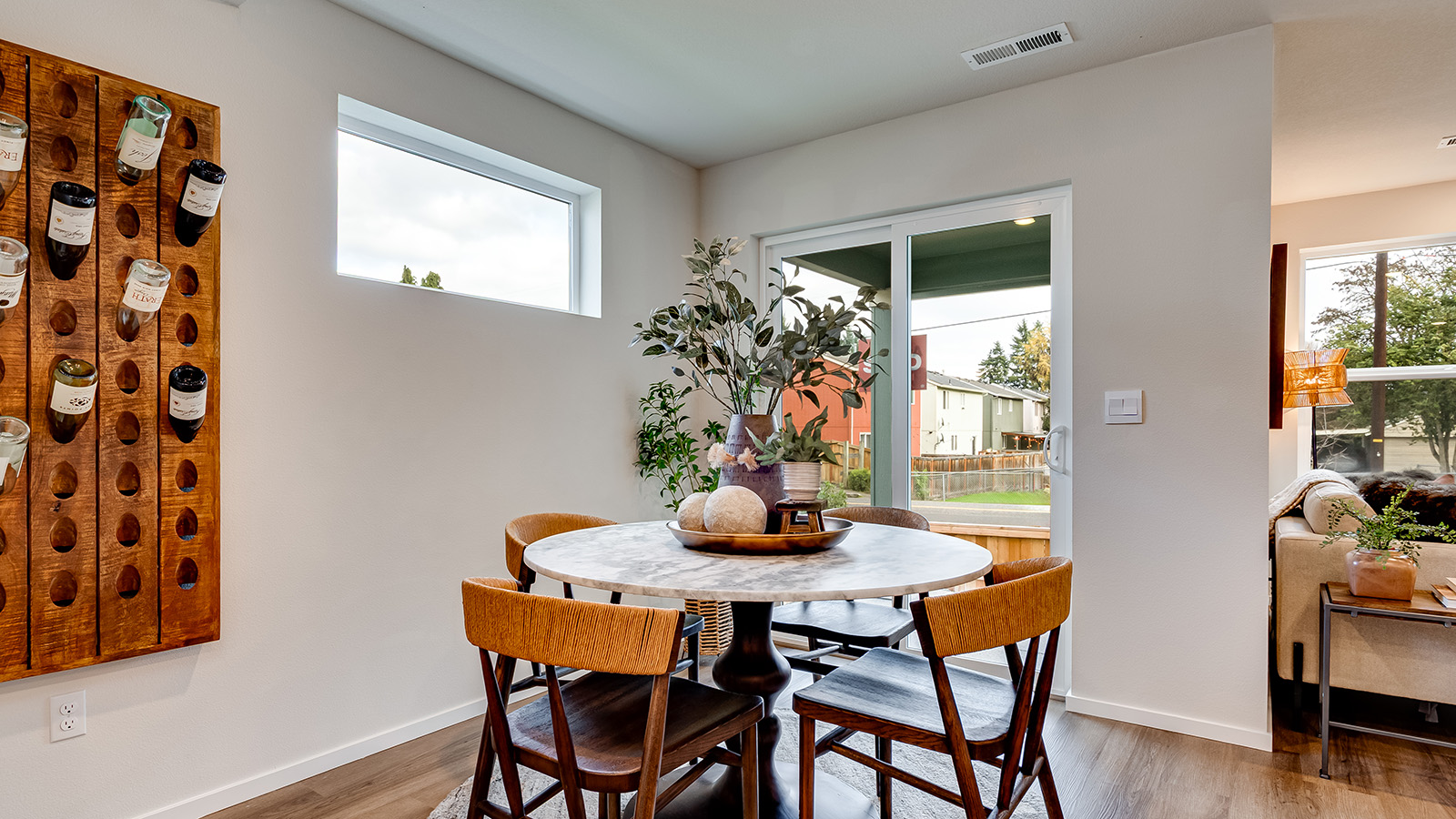 Dining area with a sliding glass door to a fenced backyard