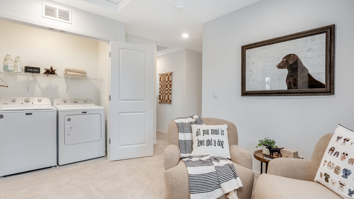Laundry closet with wire shelves and washer and dryer hookups