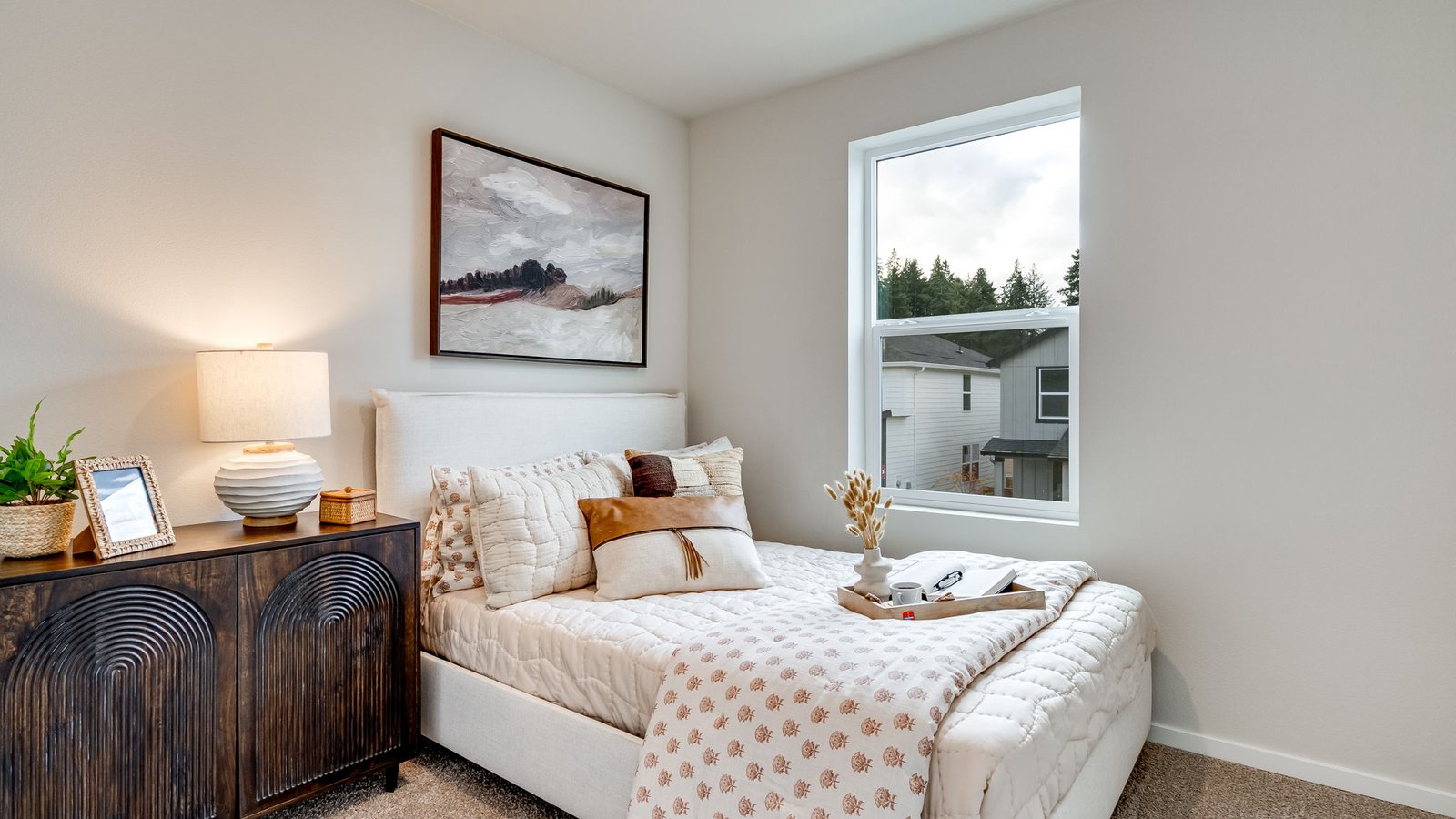 Bedroom with wall-to-wall carpet and a closet