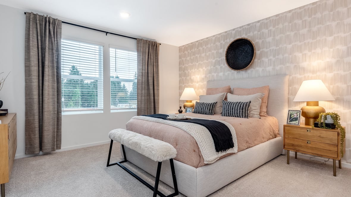Primary bedroom with wall-to-wall carpet, a walk-in closet and an attached bathroom