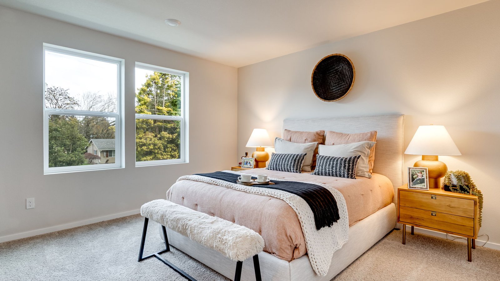 Primary bedroom with wall-to-wall carpet, a walk-in closet and an attached bathroom