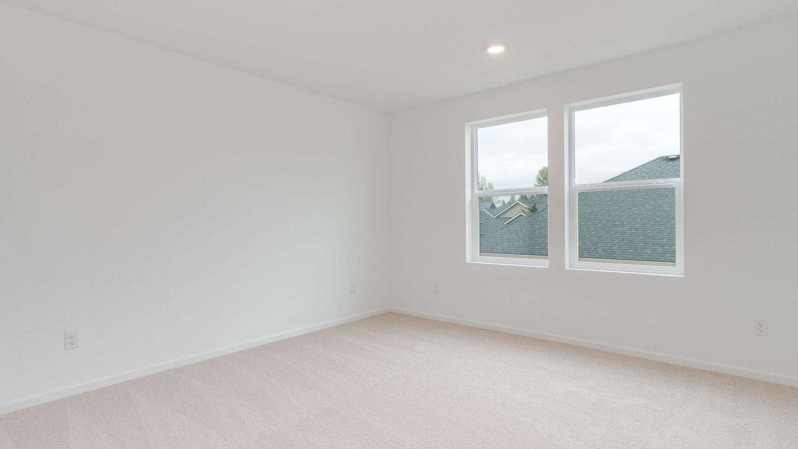 Primary bedroom with wall-to-wall carpet, a walk-in closet and an attached bathroom