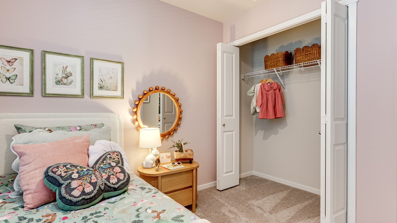 Bedroom with wall-to-wall carpet and a closet