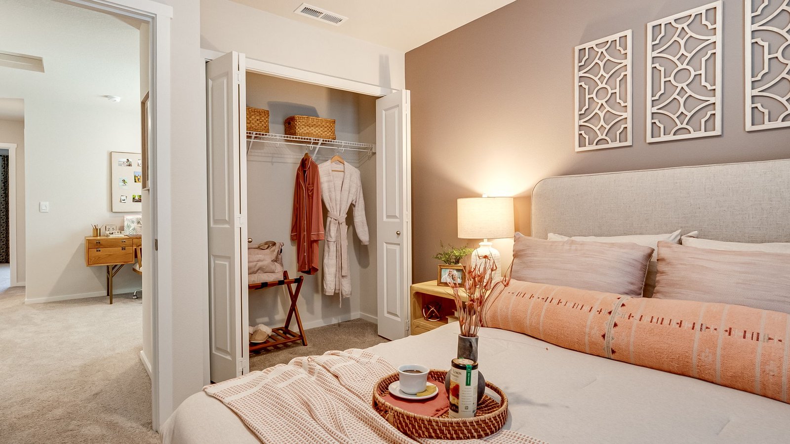 Bedroom with wall-to-wall carpet and a closet