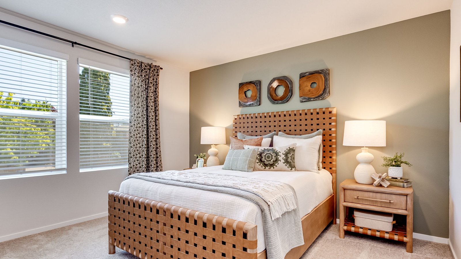 Primary bedroom with wall-to-wall carpet, a walk-in closet and an attached bathroom