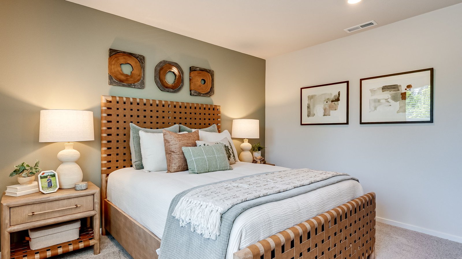 Primary bedroom with wall-to-wall carpet, a walk-in closet and an attached bathroom