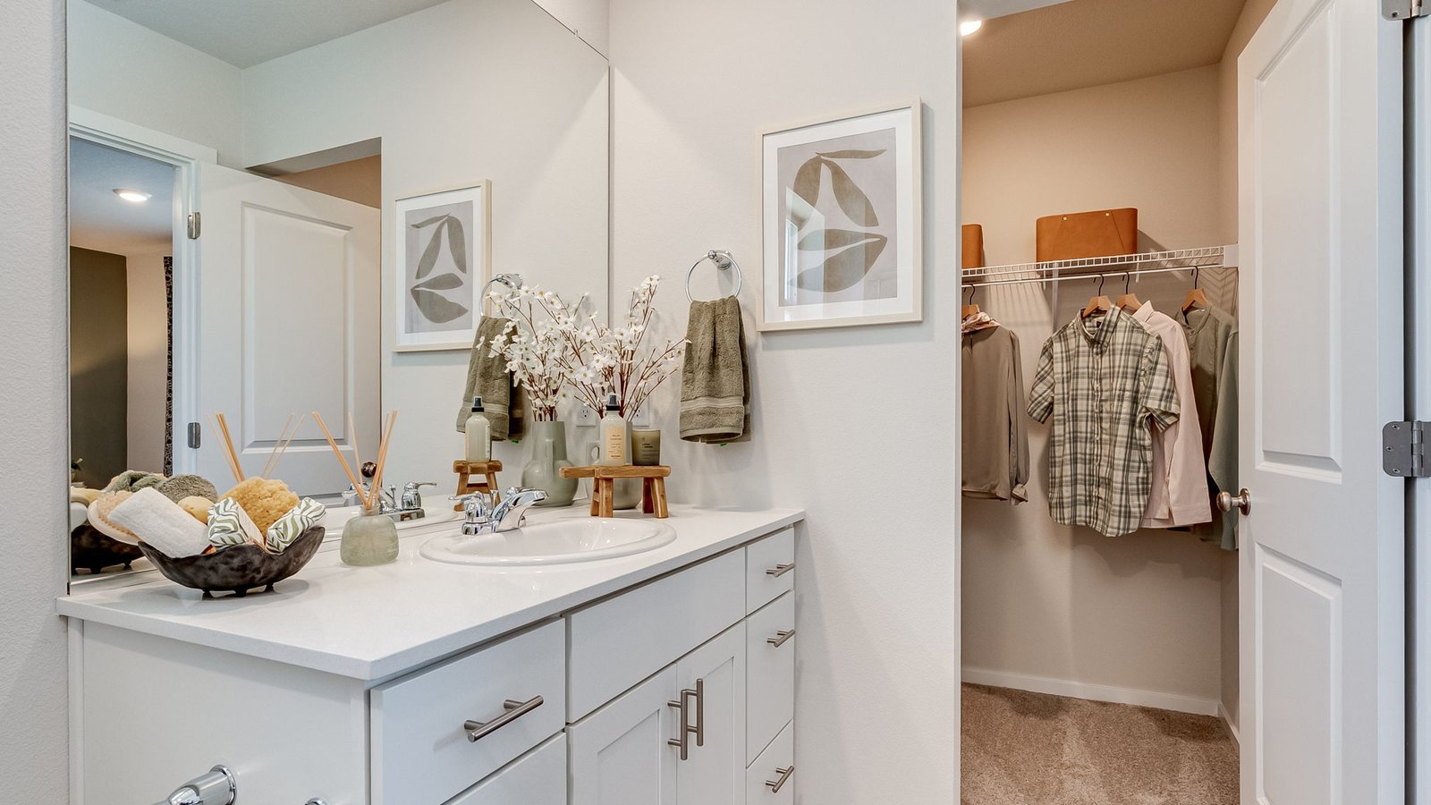 Primary bathroom with quartz counters and a walk-in shower