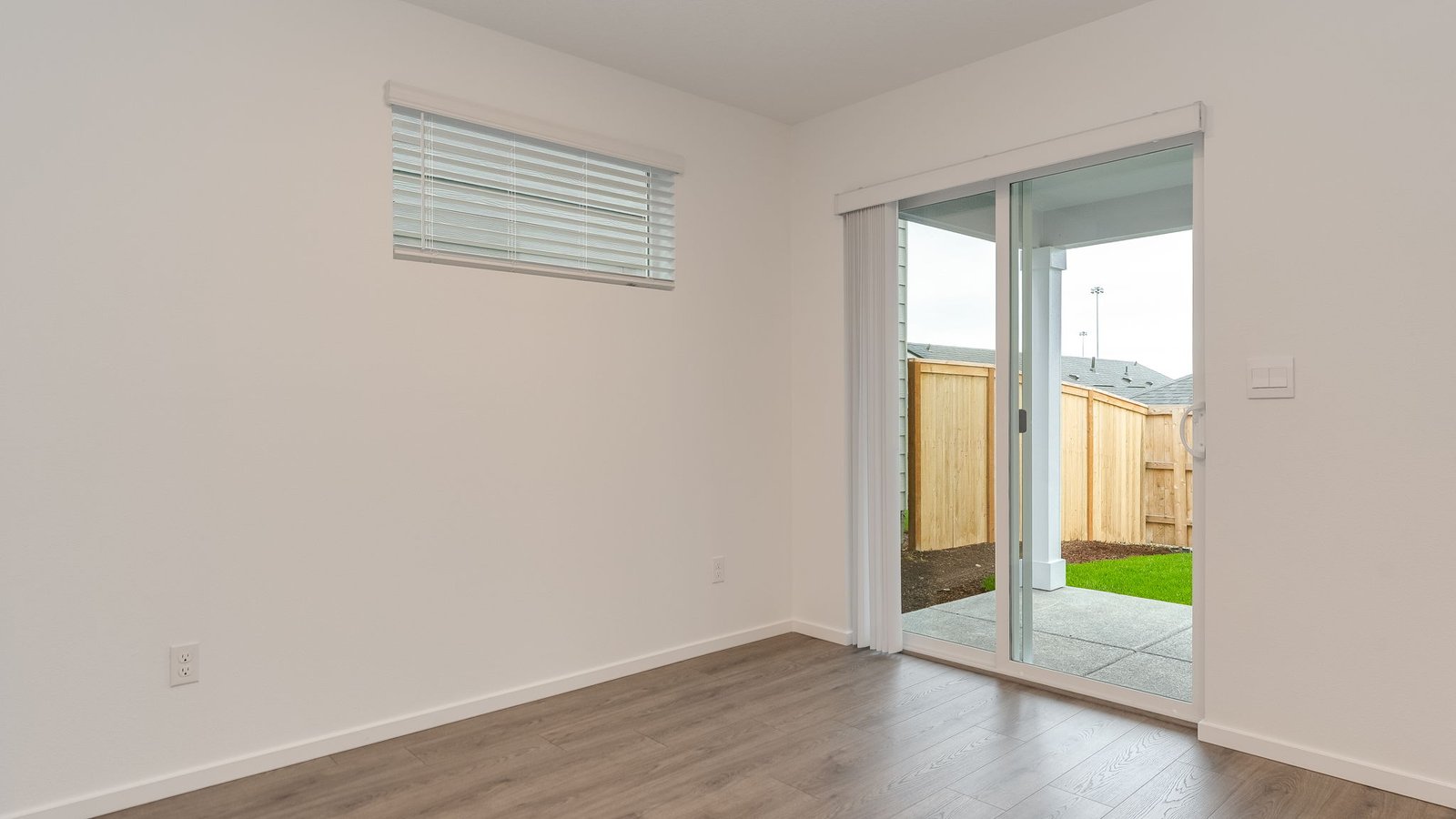Dining area with a sliding glass door to a fenced backyard