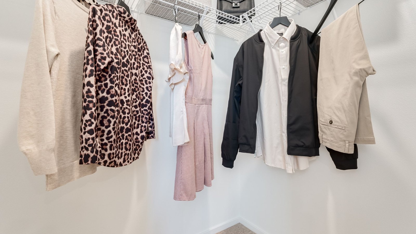 Primary bedroom walk-in closet with wire shelves
