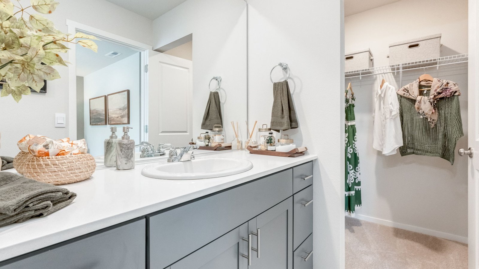 Primary bathroom with quartz counters and a walk-in shower