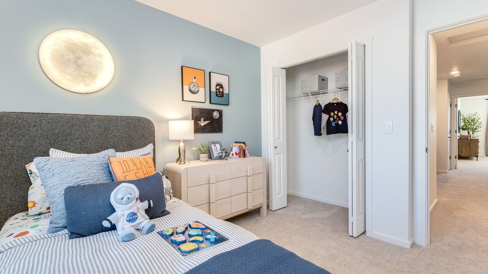 Bedroom with wall-to-wall carpet and a closet