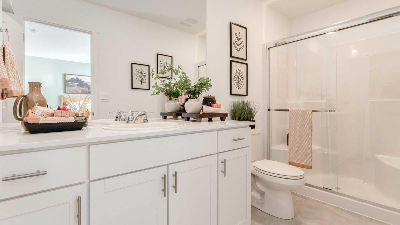 Primary bathroom with quartz counters and a walk-in shower
