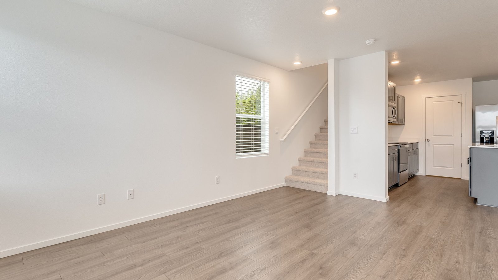 Great room with laminate flooring
