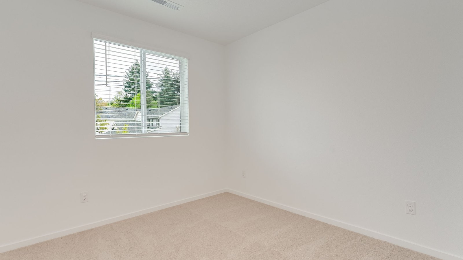 Bedroom with wall-to-wall carpet and a closet