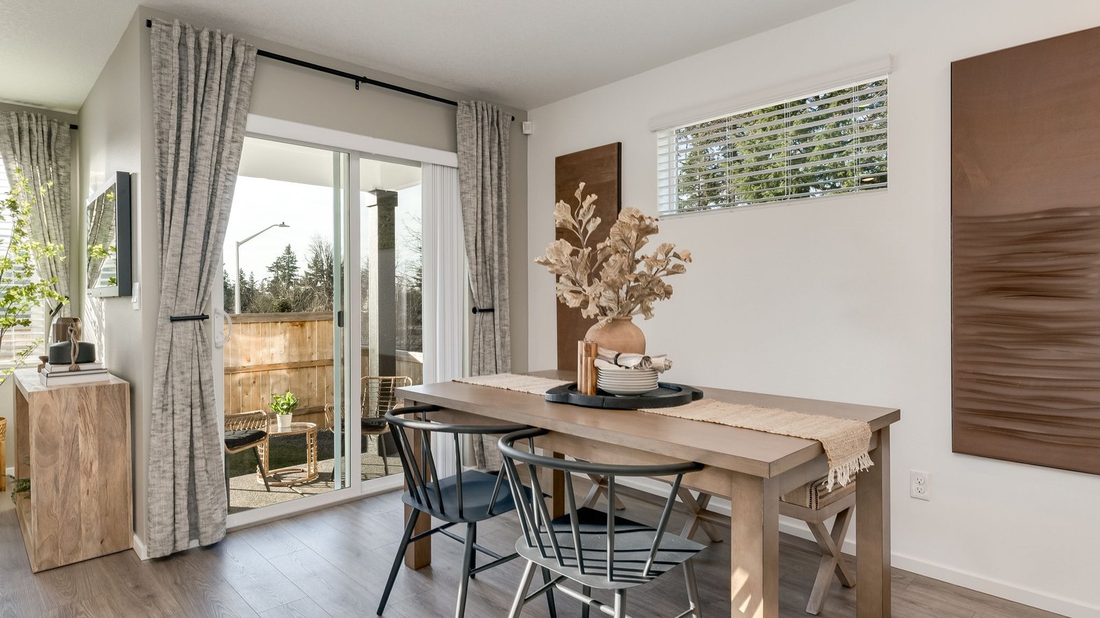 Dining area with a sliding glass door to a fenced backyard