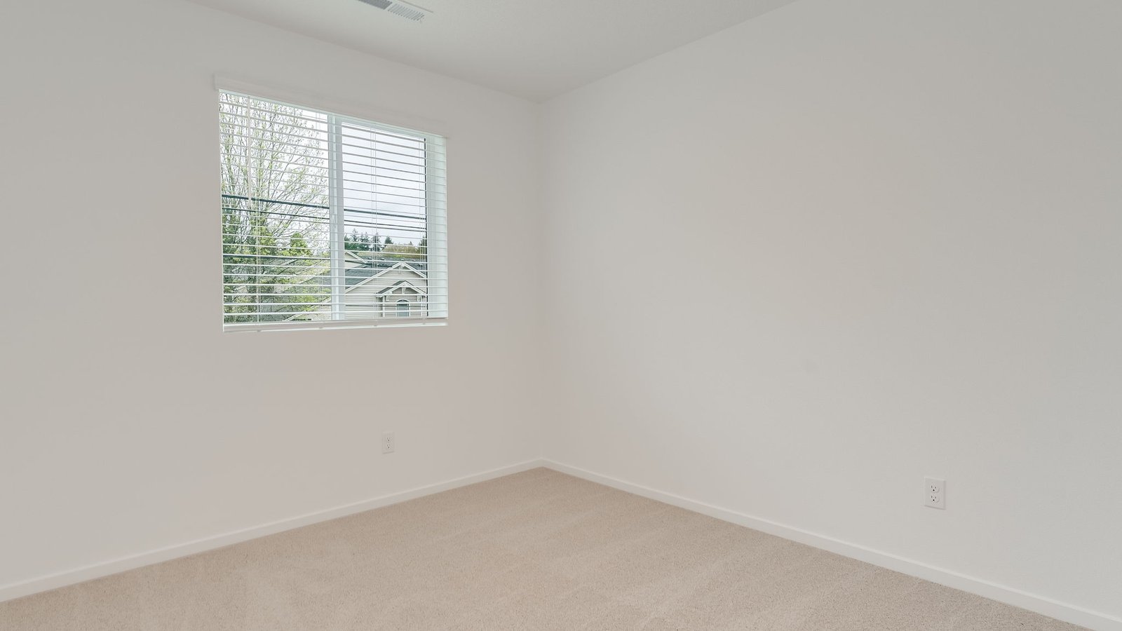 Bedroom with wall-to-wall carpet and a closet