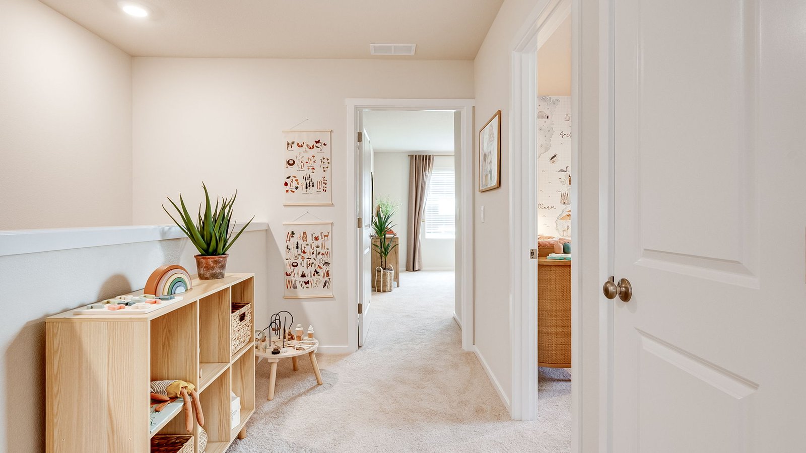 Hallway with wall-to-wall carpet