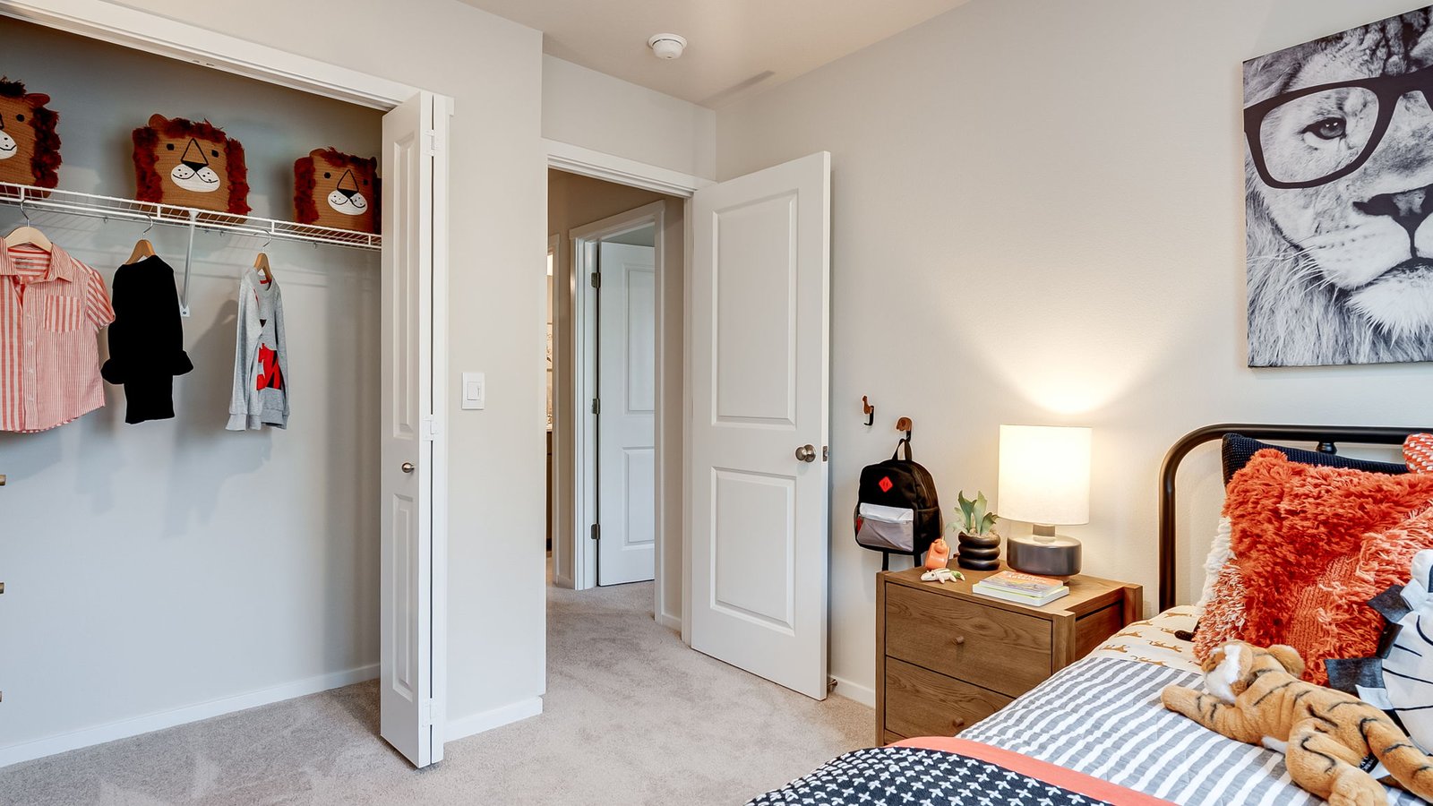 Bedroom with wall-to-wall carpet and a closet