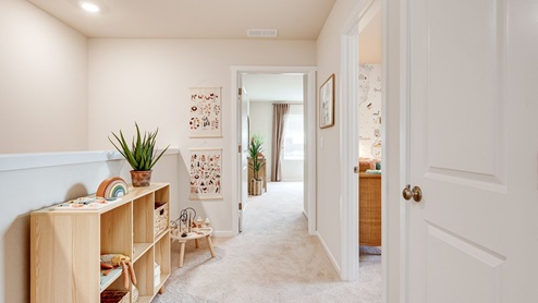 Hallway with wall-to-wall carpet
