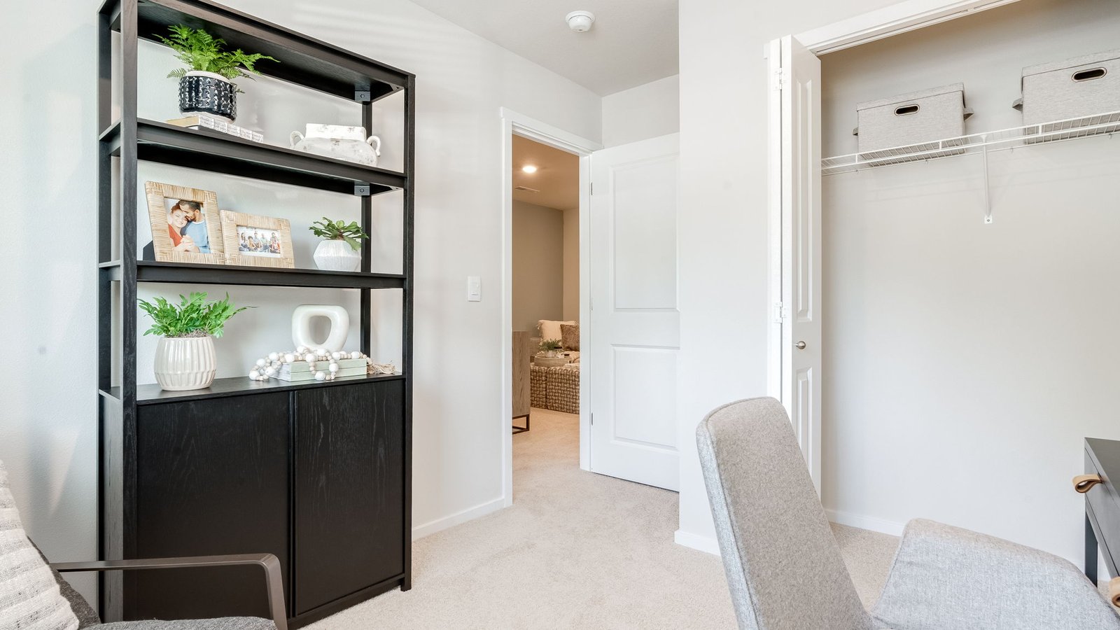 Bedroom with wall-to-wall carpet and a closet
