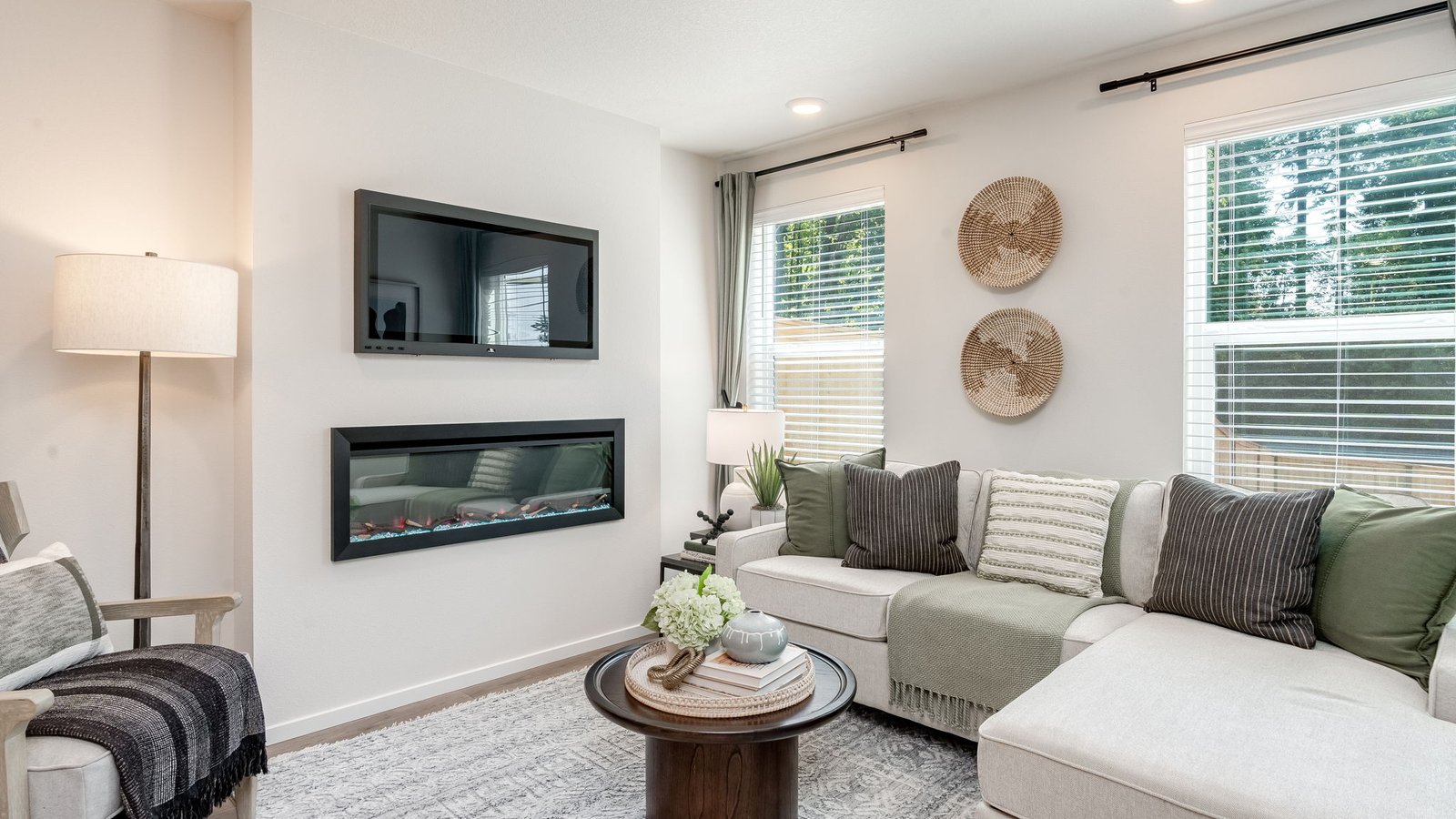 Great room with laminate flooring and an electric fireplace